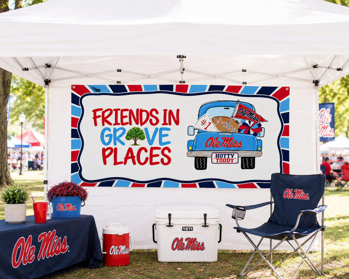 Football tailgate tent setup with personalized ole miss football game day banner 