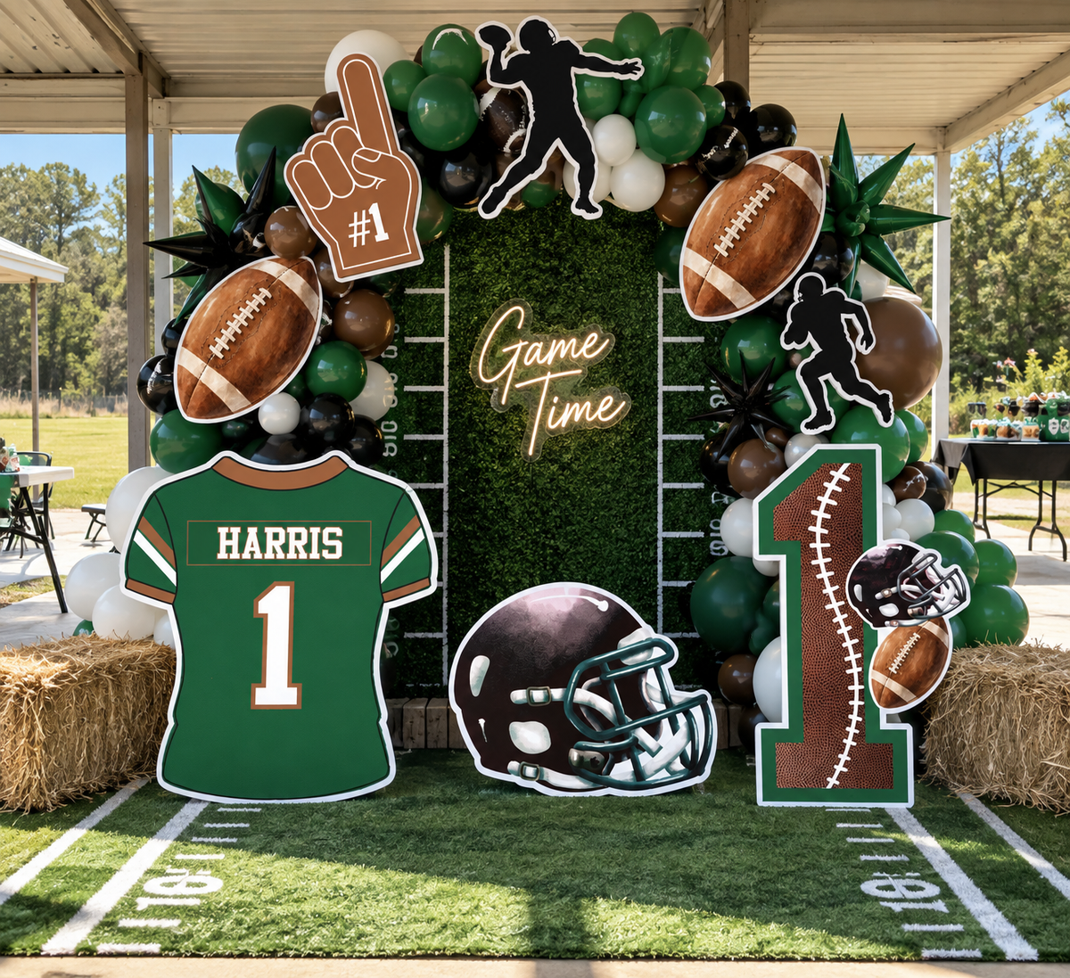Personalized football party prop set with jersey, helmet, footballs, players, foam finger and custom team colors
